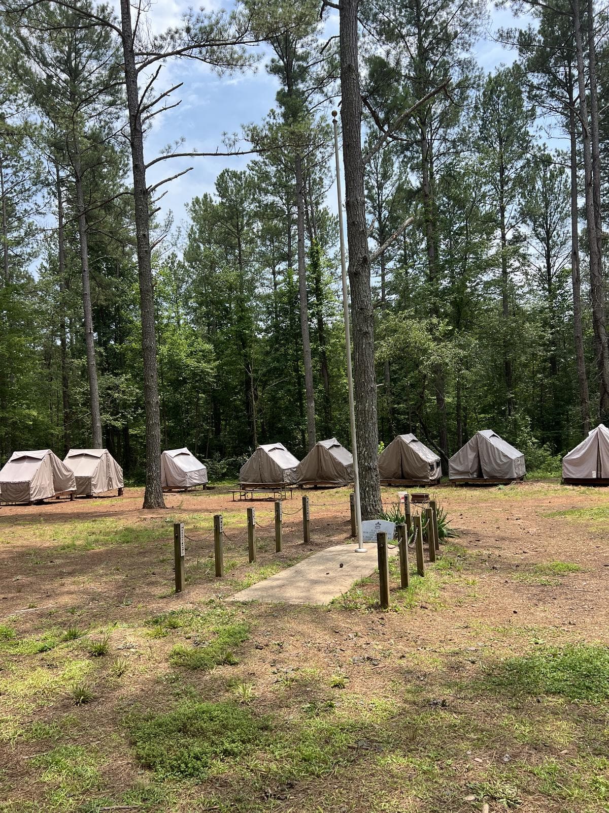 A row of troop tents at a patrol campsite