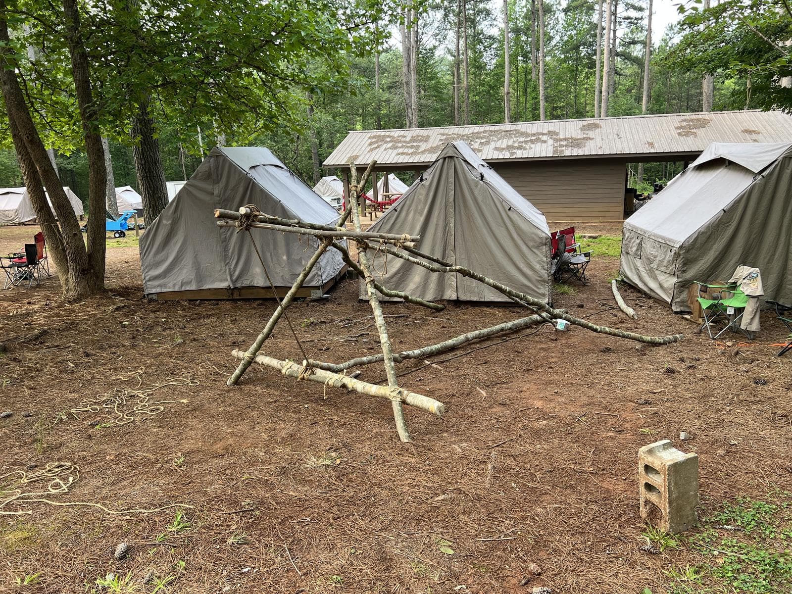A pioneering lashing project built from poles and rope at a campsite